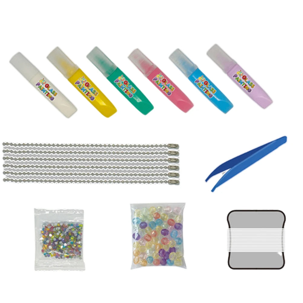 Pendant decorating supplies with six markers, chains, blue tweezers, decorative pieces, beads and thread