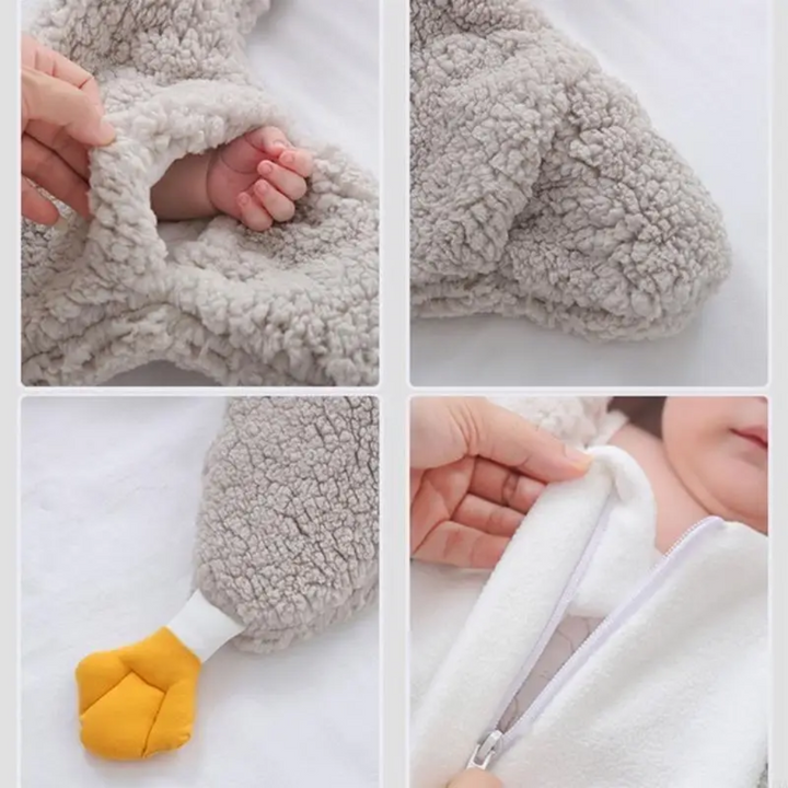 Penguin jumpsuit details showing a sleeve opening, textured fabric, yellow foot, and front zipper