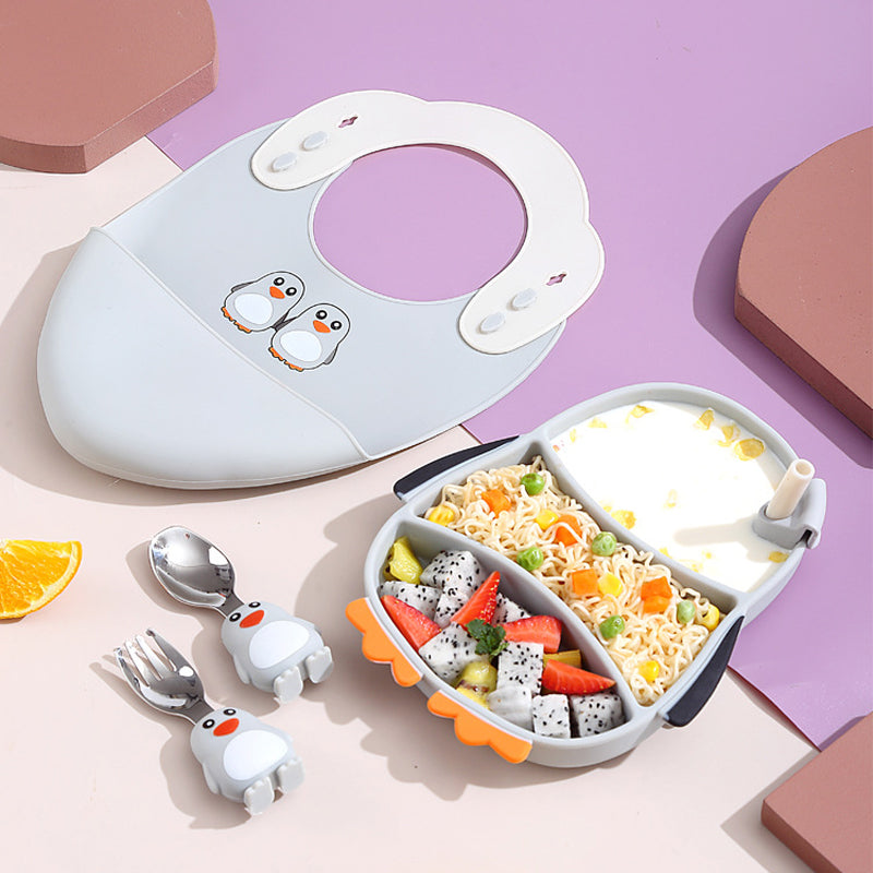 Filled penguin plate with a coordinating bib and penguin-handled fork and spoon