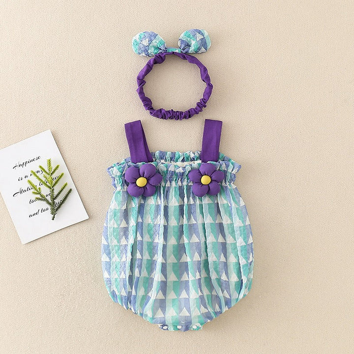Blue geometric-print baby romper with purple straps and flower accents, shown beside a matching headband