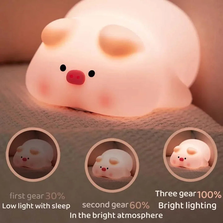 Pig night light with three brightness levels shown