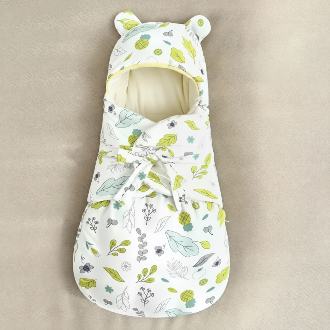 Pineapple and leaf-print baby swaddle blanket with a front tie and rounded hood ears