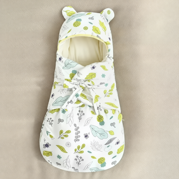 Pineapple and leaf-print baby swaddle blanket with a front tie and rounded hood ears