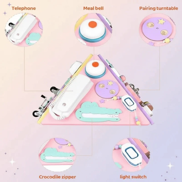 Pink activity panel with a play telephone, bell, crocodile-shaped zipper, and switch