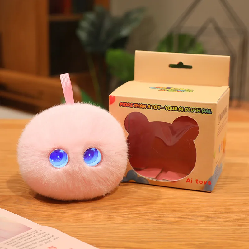 Pink round AI plush toy with blue eyes beside its retail box