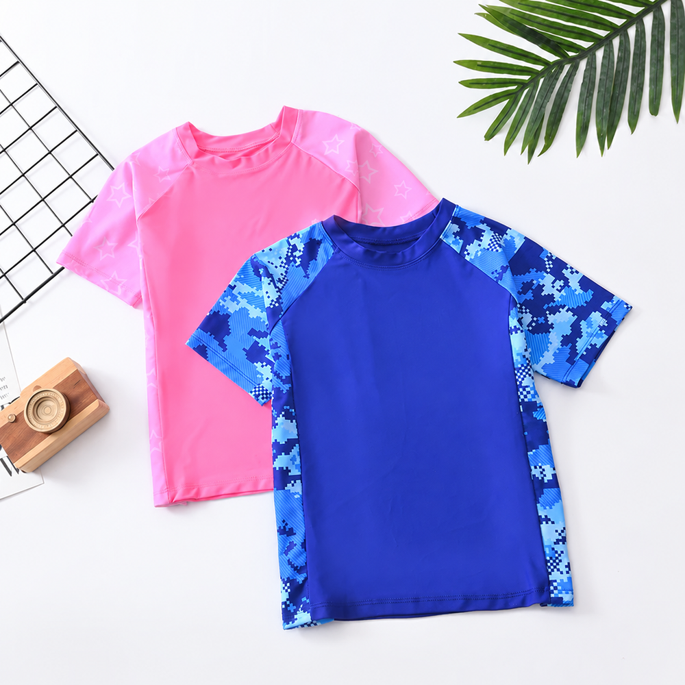 Pink and blue short-sleeve swim shirts, with patterned sleeves on the blue shirt