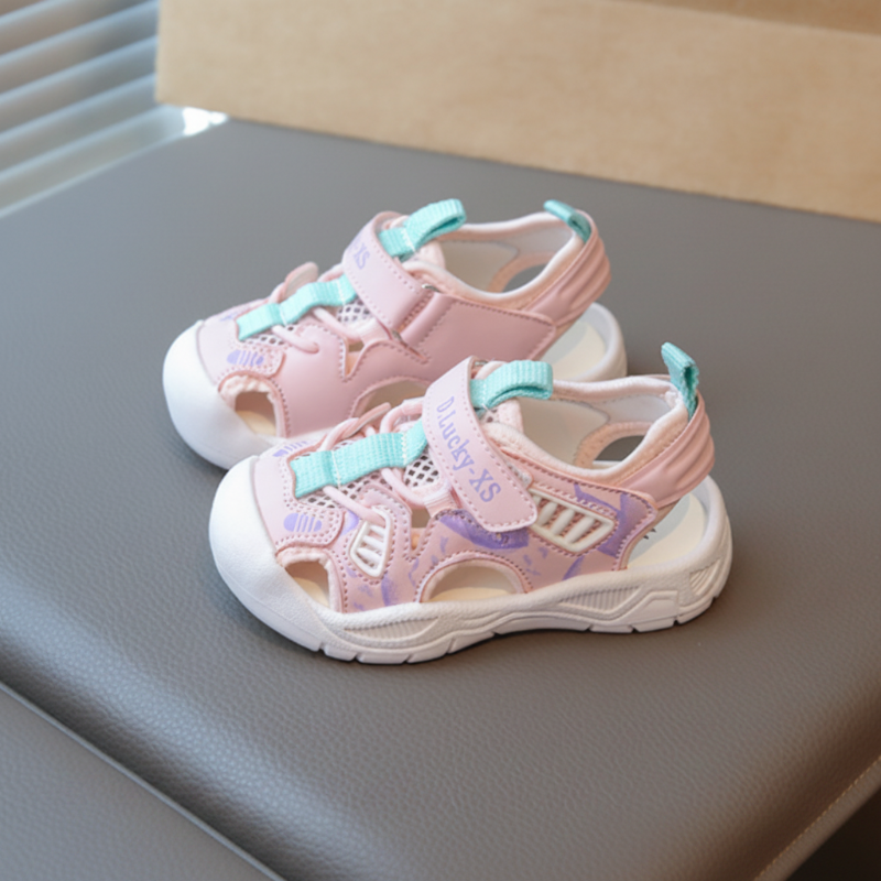 Pink closed-toe sandals with aqua accents and cream soles