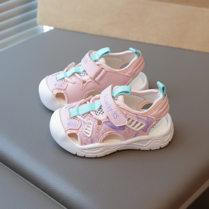 Pink closed-toe sandals with aqua accents and cream soles