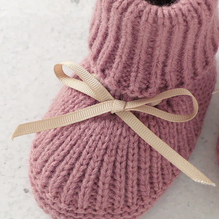 Close-up of a pink baby bootie&