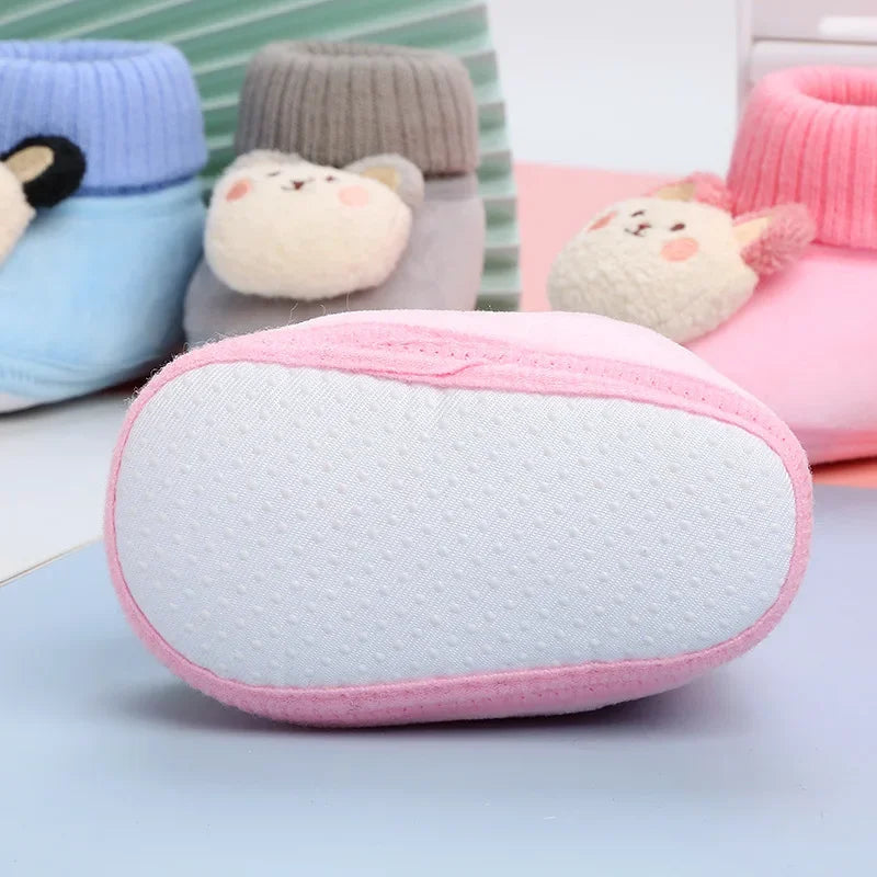 Lightly textured white sole on a pink baby slipper