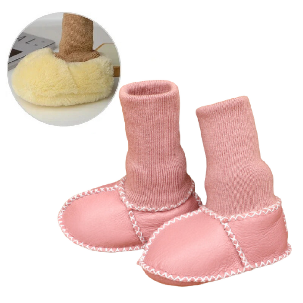 Pink baby slippers with tall matching knit cuffs and white stitching