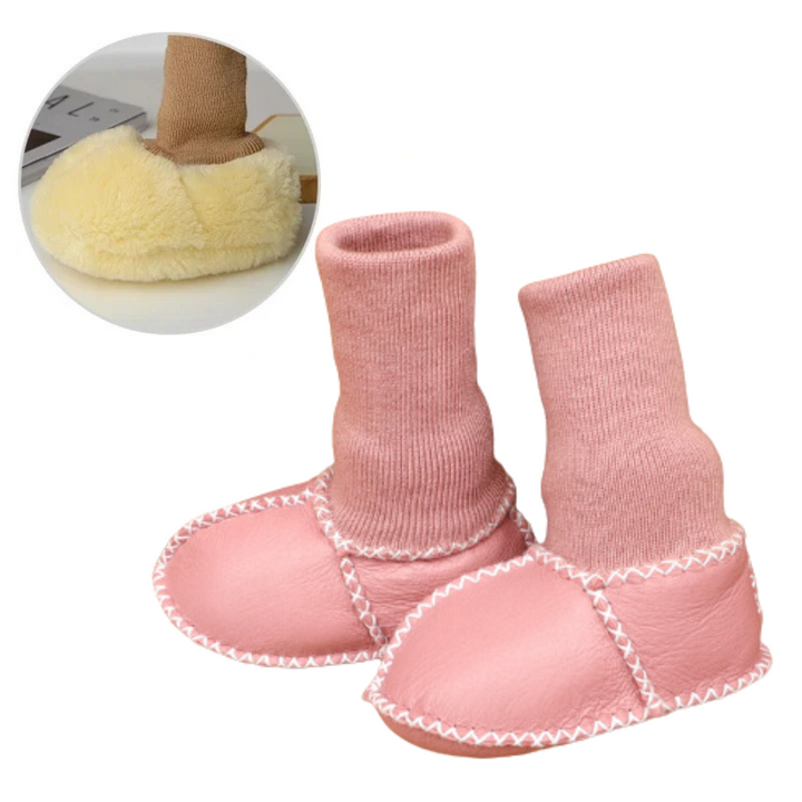Pink baby slippers with tall matching knit cuffs and white stitching