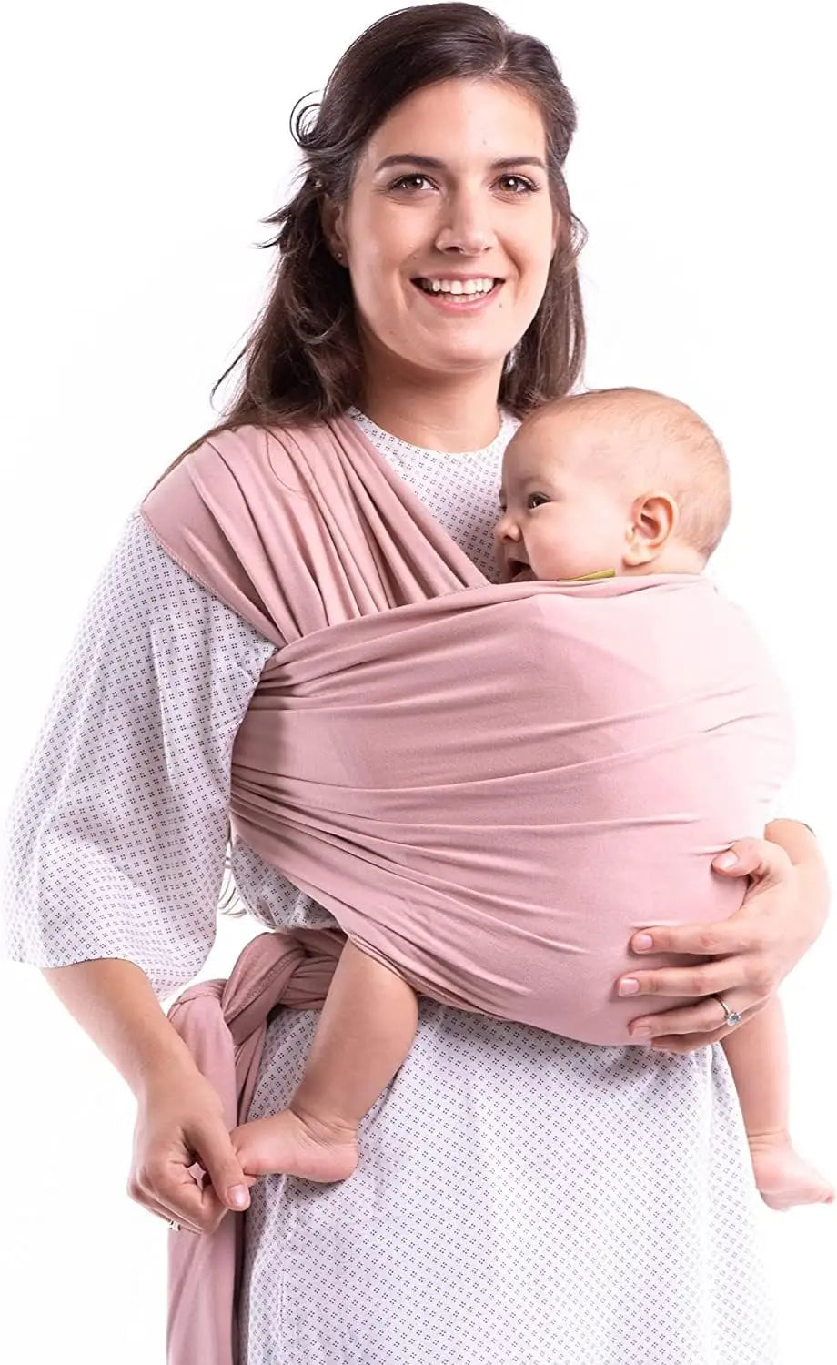 Pink baby wrap carrier worn across the shoulders and tied at the waist for front carrying.