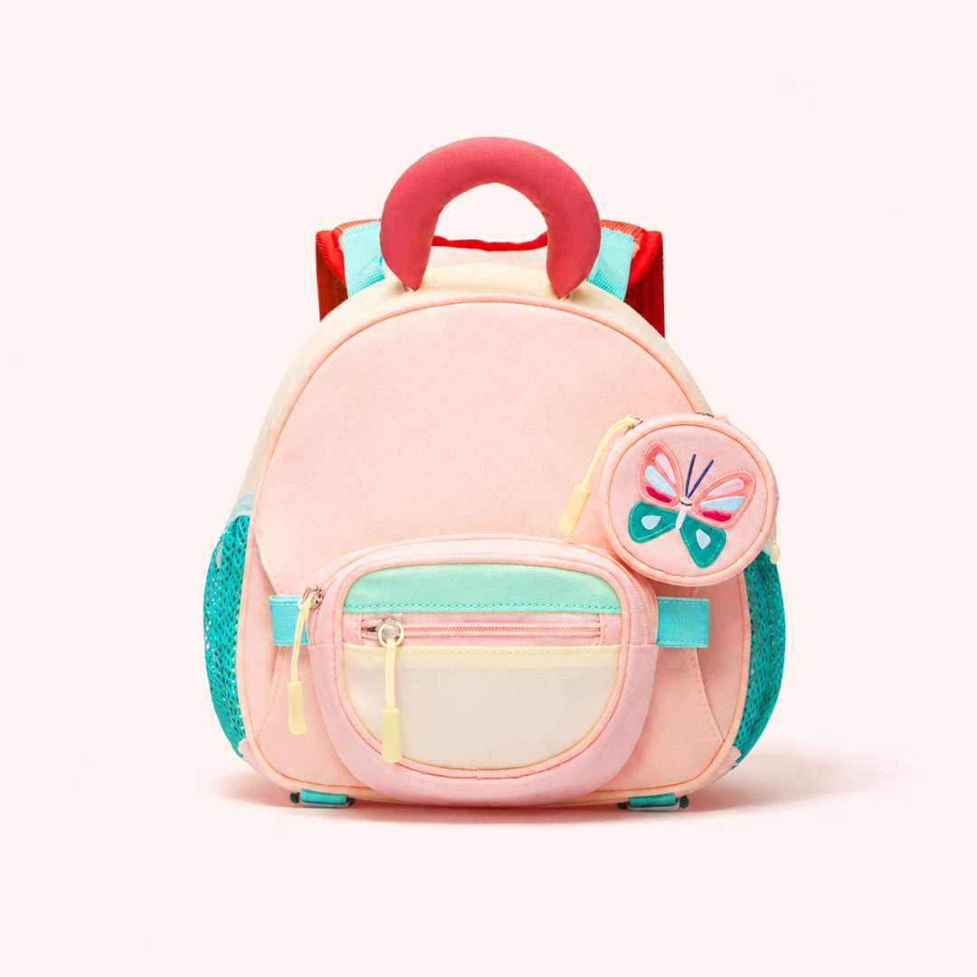 Front view of a pink backpack with teal side pockets and a round butterfly pouch