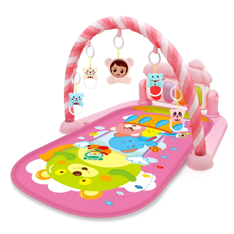 Pink baby gym with balloon and animal illustrations beneath a striped toy arch