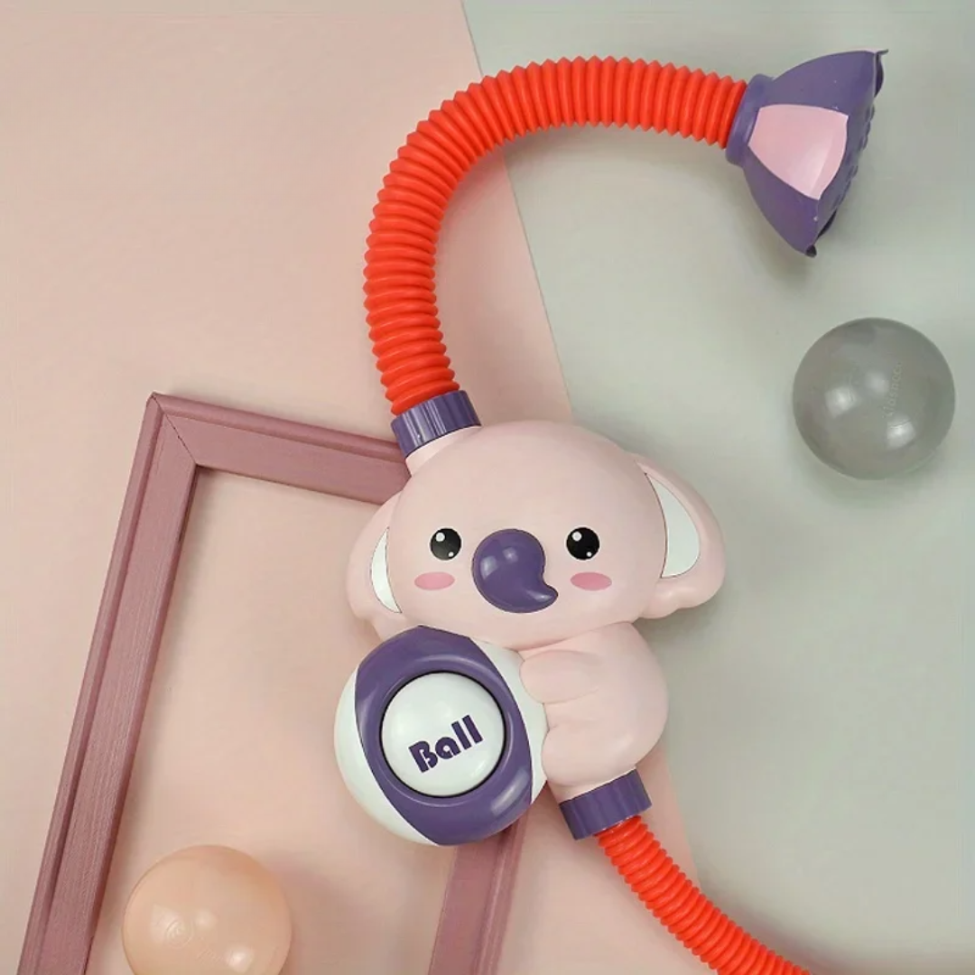 Pink character bath shower toy with red tubing and a purple shower head