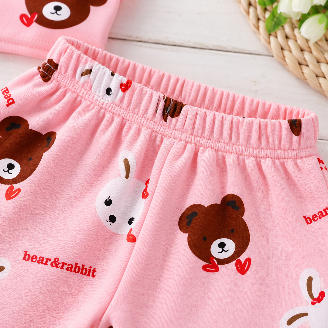 Elastic waistband detail on pink pajama pants with bear and rabbit prints