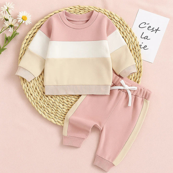 Pink, white and beige sweatshirt with pink joggers and cream side stripes