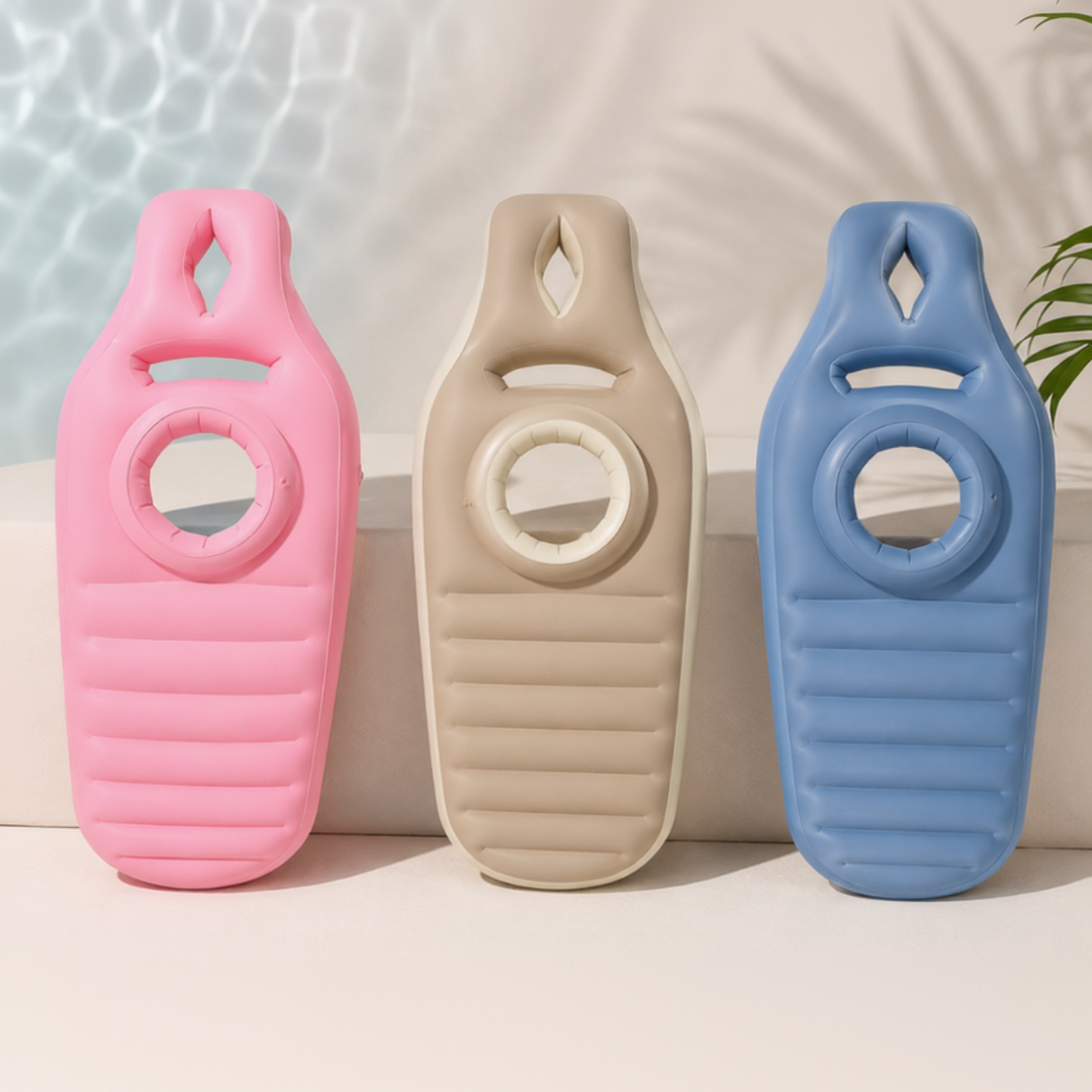 Pink, brown, and blue inflatable pregnancy pillows shown upright with circular belly openings