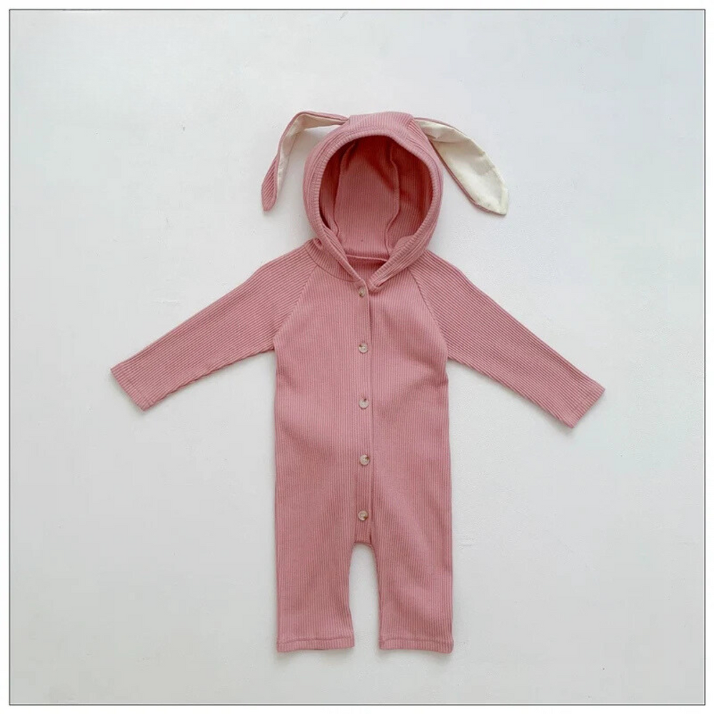 Pink cotton baby romper with a bunny-ear hood, long sleeves and a button front