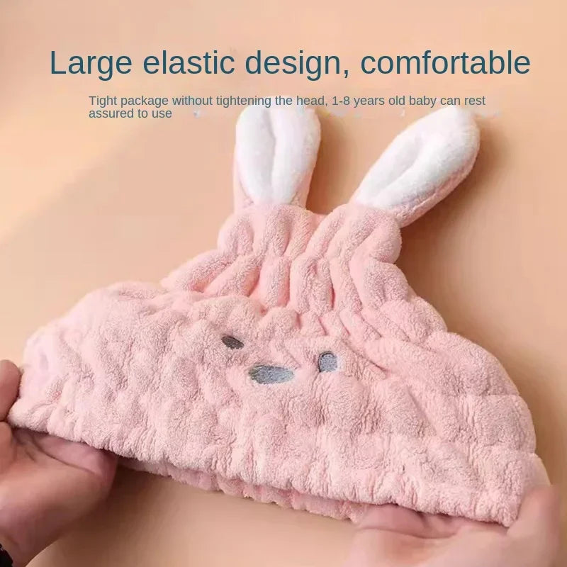 Pink bunny hair-drying cap stretched open to show its elastic band