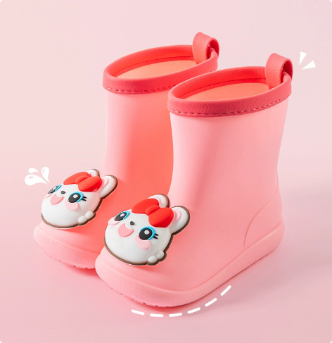 Pink bunny rain boots with red bow decorations and back pull loops