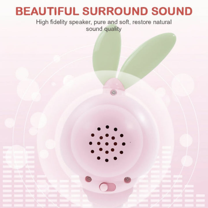 Rear view of a pink bunny rattle showing the speaker and controls