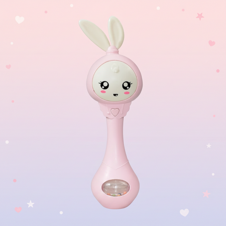 Pink bunny baby rattle with a smiling face, soft ears and a clear bead window