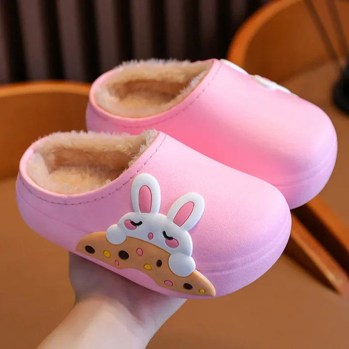 Pink bunny slippers with rounded toes and beige fluffy lining