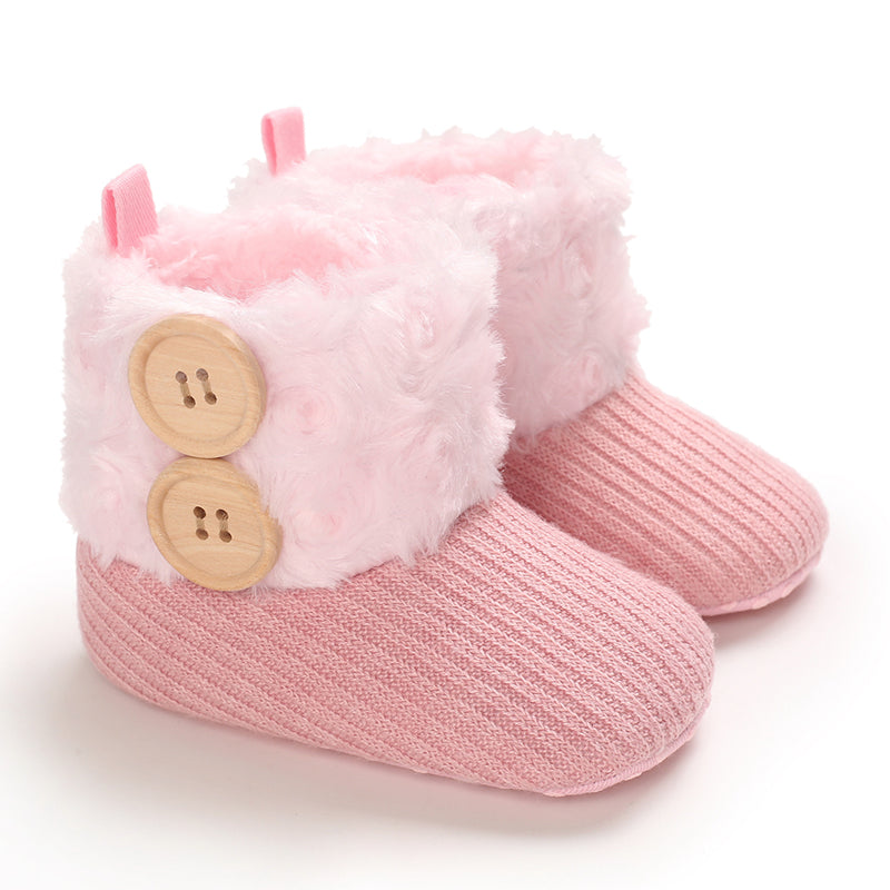 Pink baby boots with pale pink cuffs and two decorative buttons