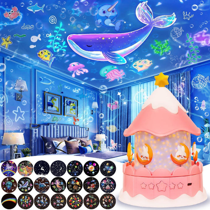 Pink carousel-style projector night light shown with a whale-themed room projection and film designs.