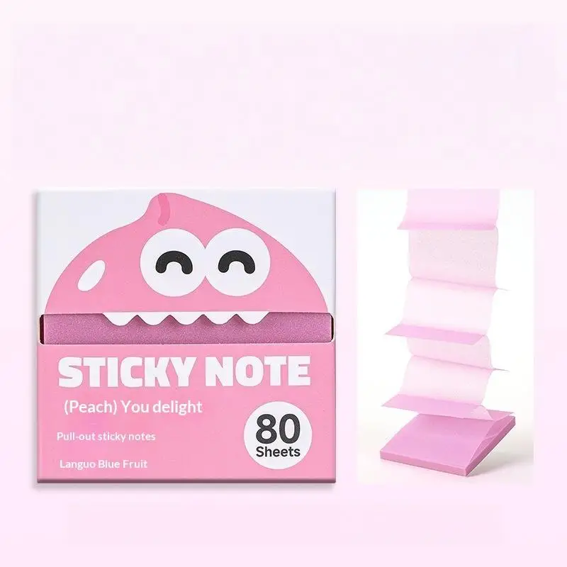 Pink sticky note pack with a cartoon face beside extended sheets
