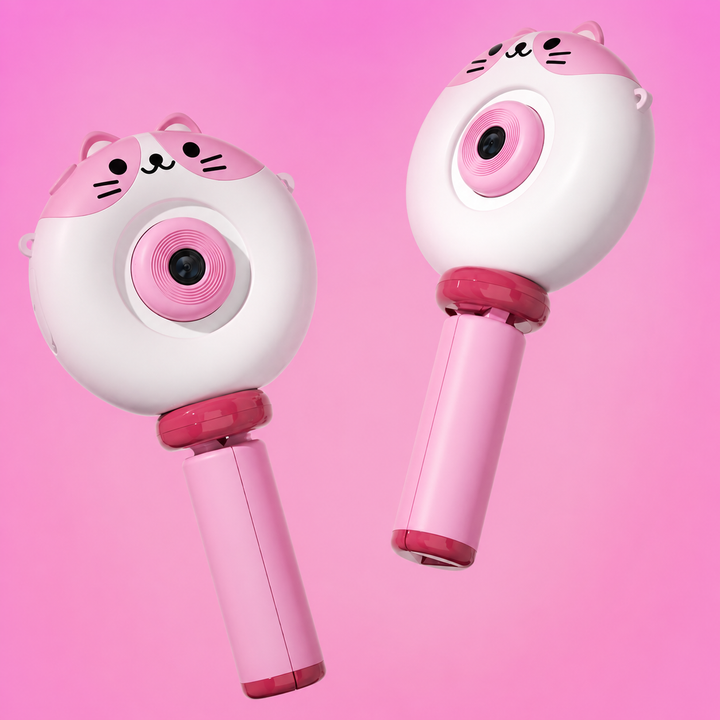 Two angled views of the pink cat camera with its handle folded closed