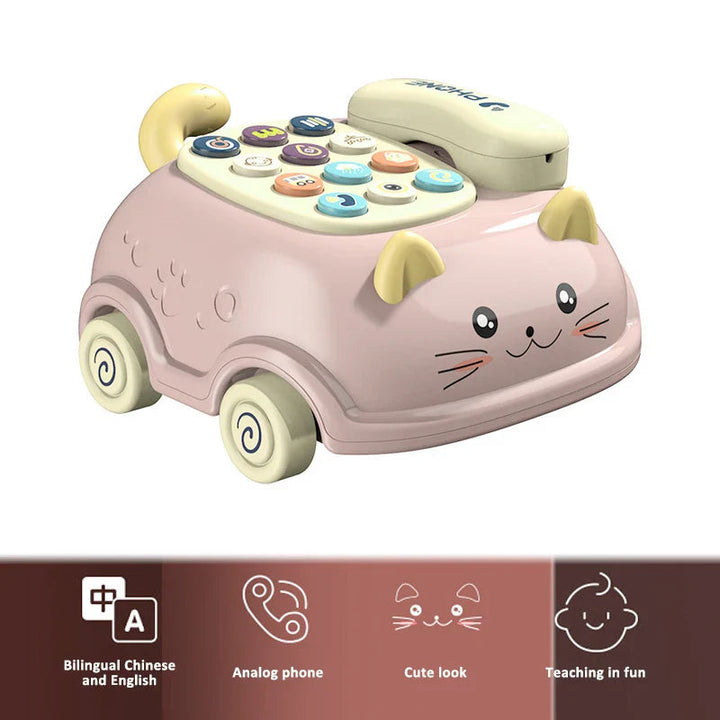 Pink cat-shaped toy phone with a cream handset, wheels and multicolored keypad