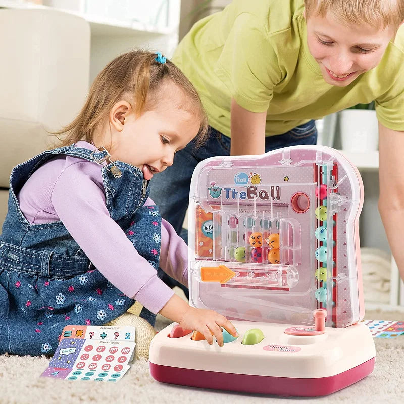 Child pressing the colored buttons on a pink ball-track math game