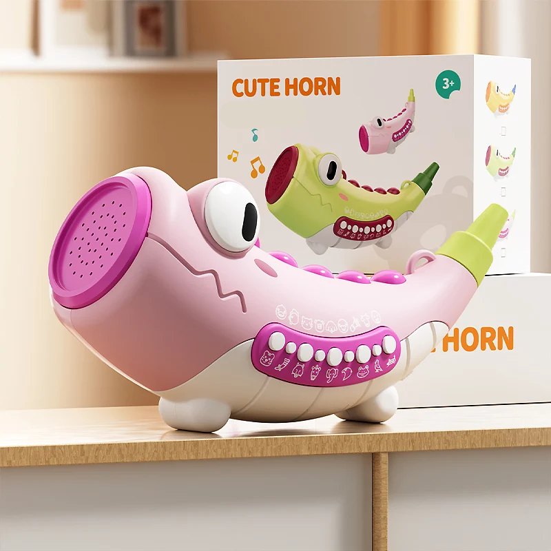 Pink crocodile musical toy displayed with its retail box