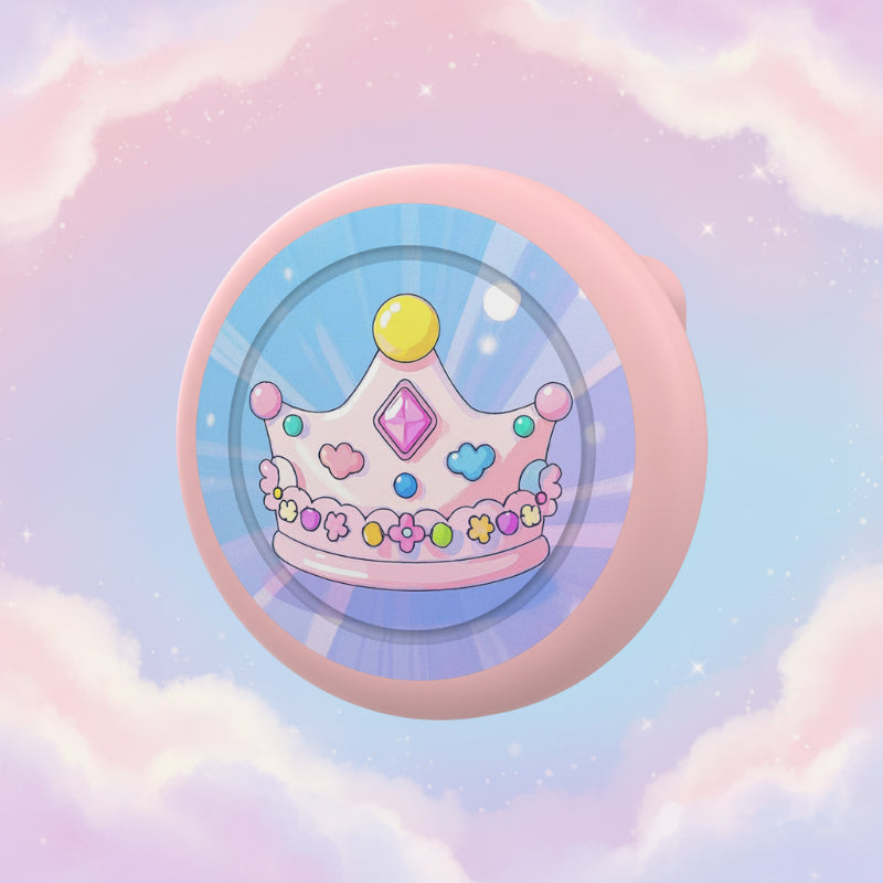 Pink AirTag brooch case with a colorful crown design