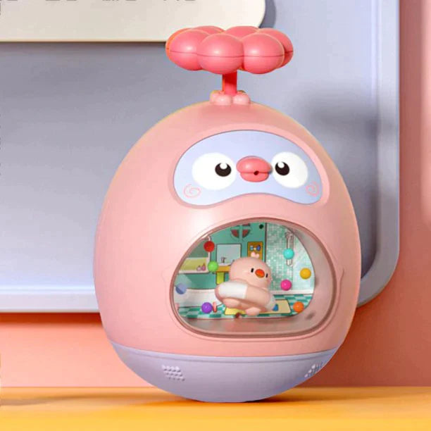 Pink duck-shaped bath toy on a ledge with a small duck visible through its front window