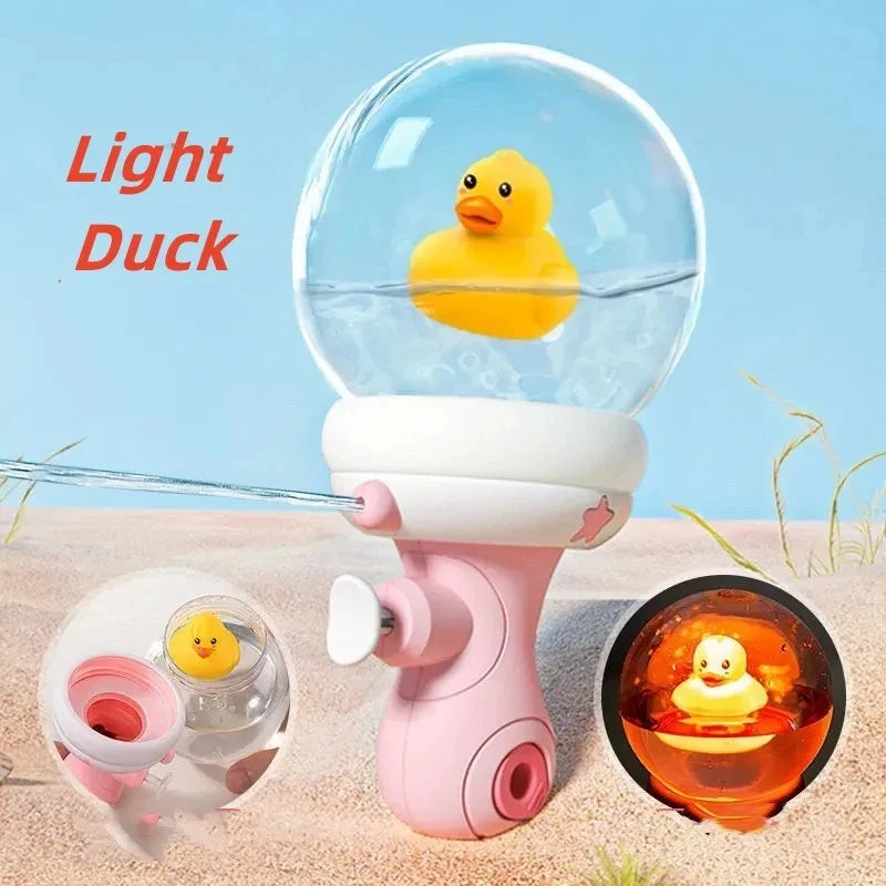 Pink duck water gun with a yellow duck inside the clear globe and an illuminated detail inset