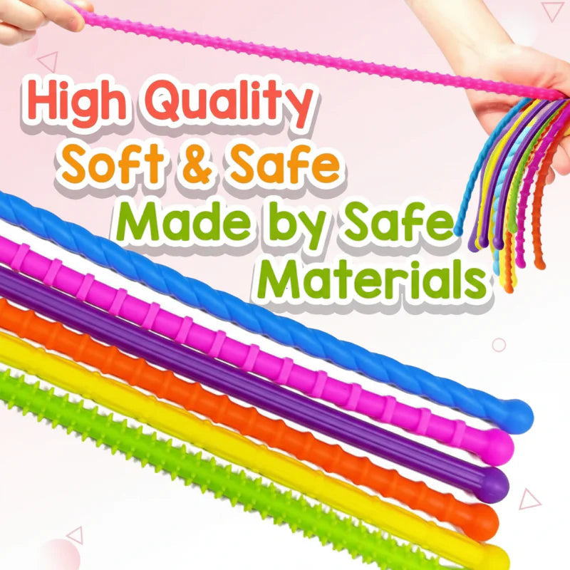 Hands stretching a pink sensory stick above a close-up of colorful textured sticks
