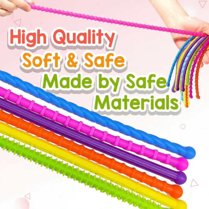 Hands stretching a pink sensory stick above a close-up of colorful textured sticks