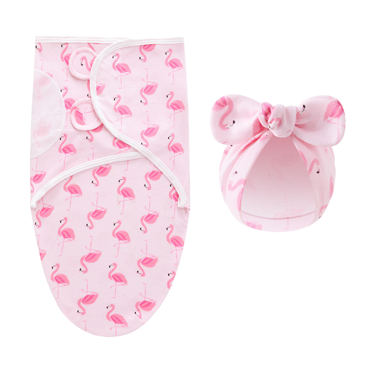 Pink swaddle blanket and matching bow hat with a flamingo pattern