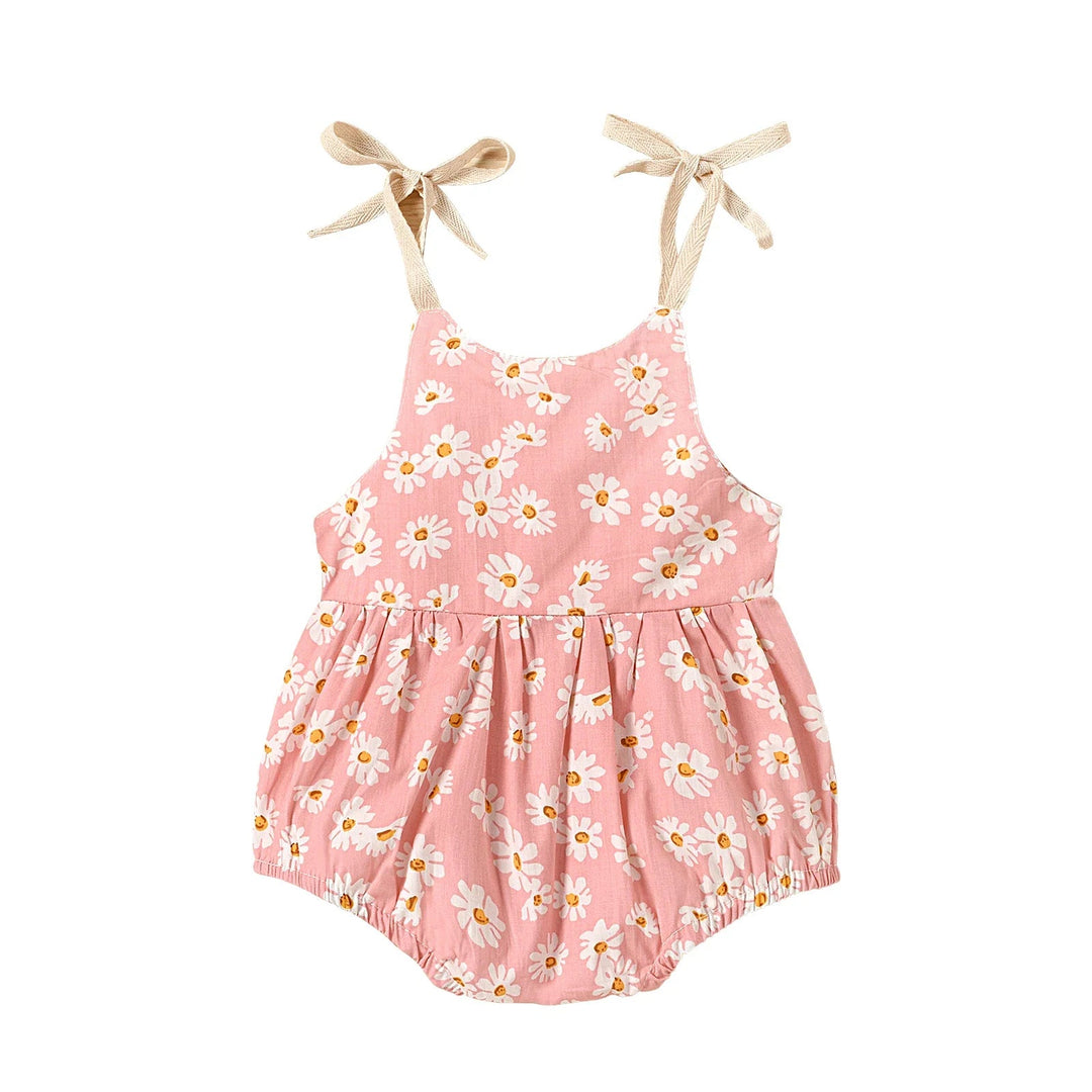 Pink baby romper with white flowers and a gathered waist