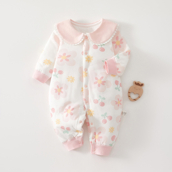 Pink-trim baby pajamas with flowers, cherries, and a rounded collar