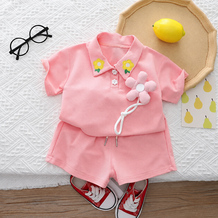 Pink collared top and shorts set with flower embroidery at the collar