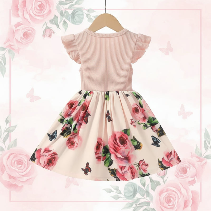 Back view of a pink dress with a ribbed bodice and rose-and-butterfly skirt
