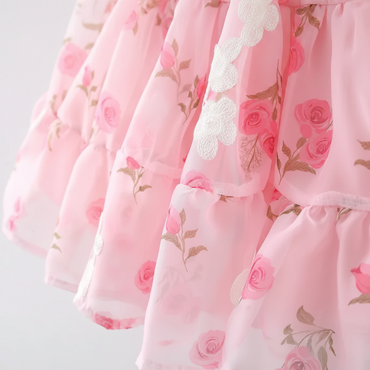 Pink floral skirt tiers with scalloped white trim