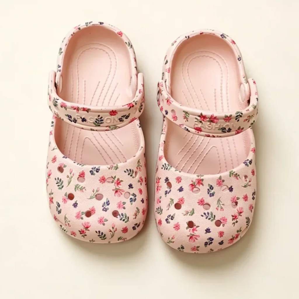 Top view of pink floral sandals with textured footbeds and adjustable straps