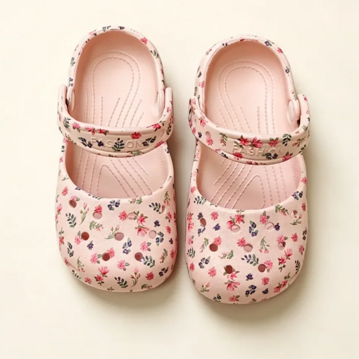 Top view of pink floral sandals with textured footbeds and adjustable straps