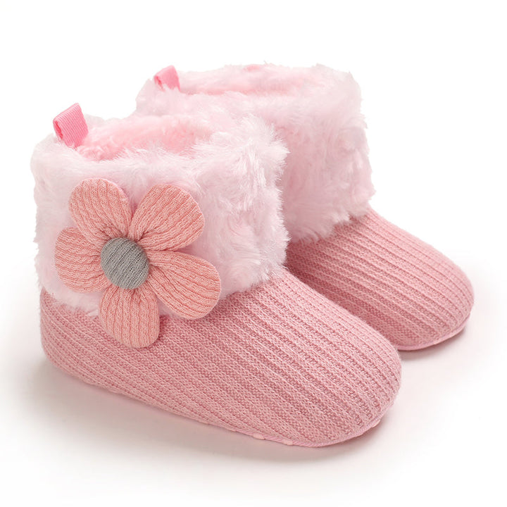 Pink baby winter boots with flower accents and pale pink plush cuffs
